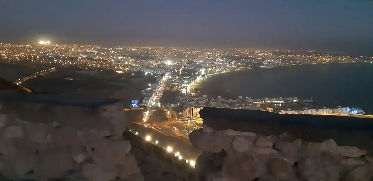 The lights of the corniche at night from the kasbah